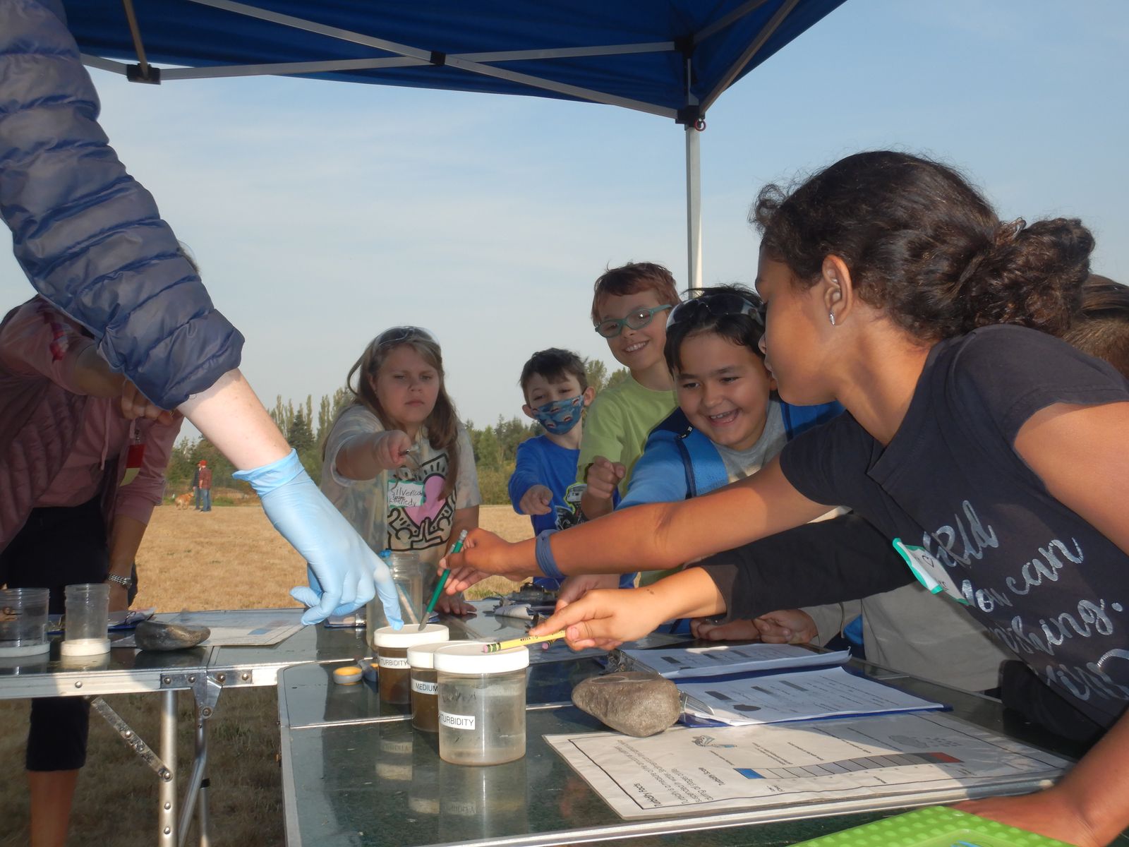 Fourth graders doing field science at a creek